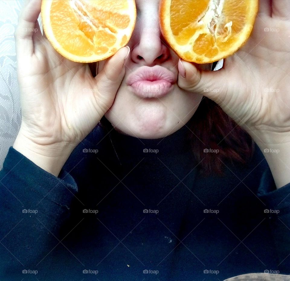 Crazy portrait with oranges