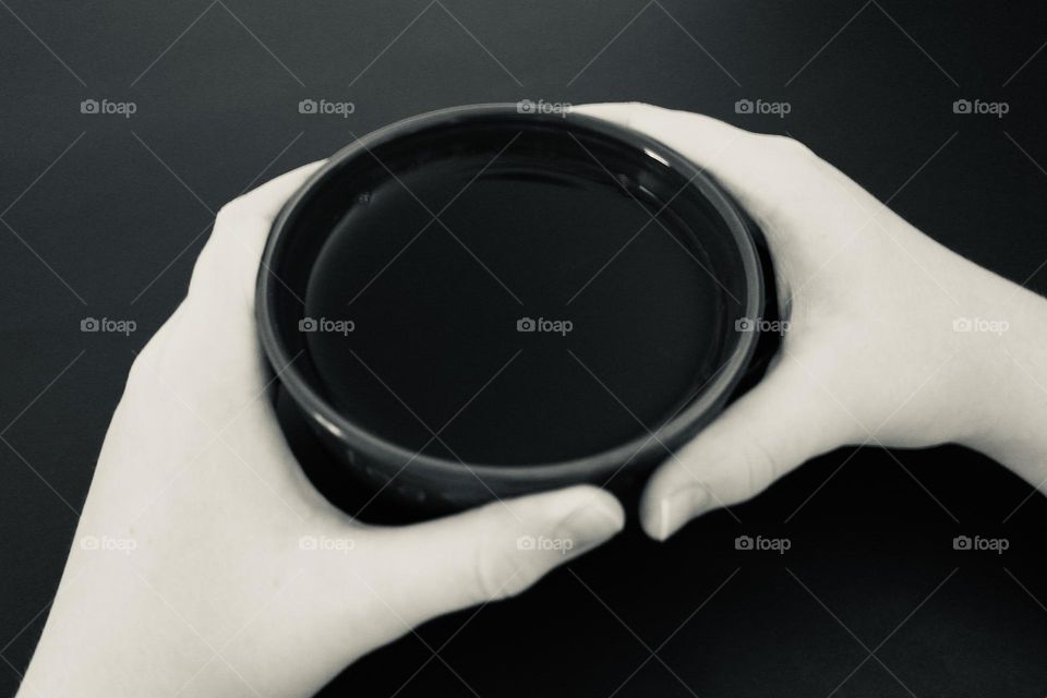 Hands hold mug of tea 