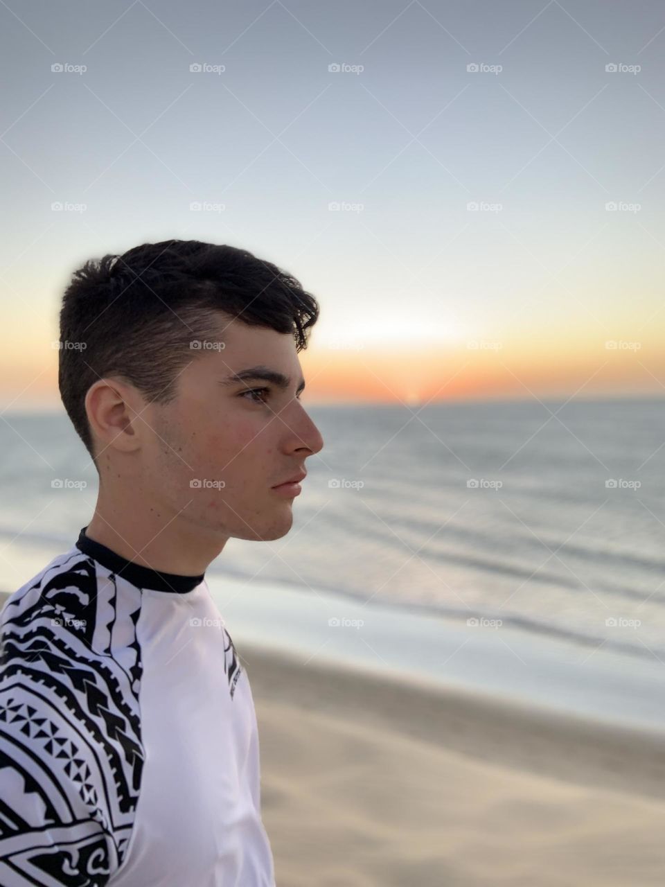Profile Boy against sunset 