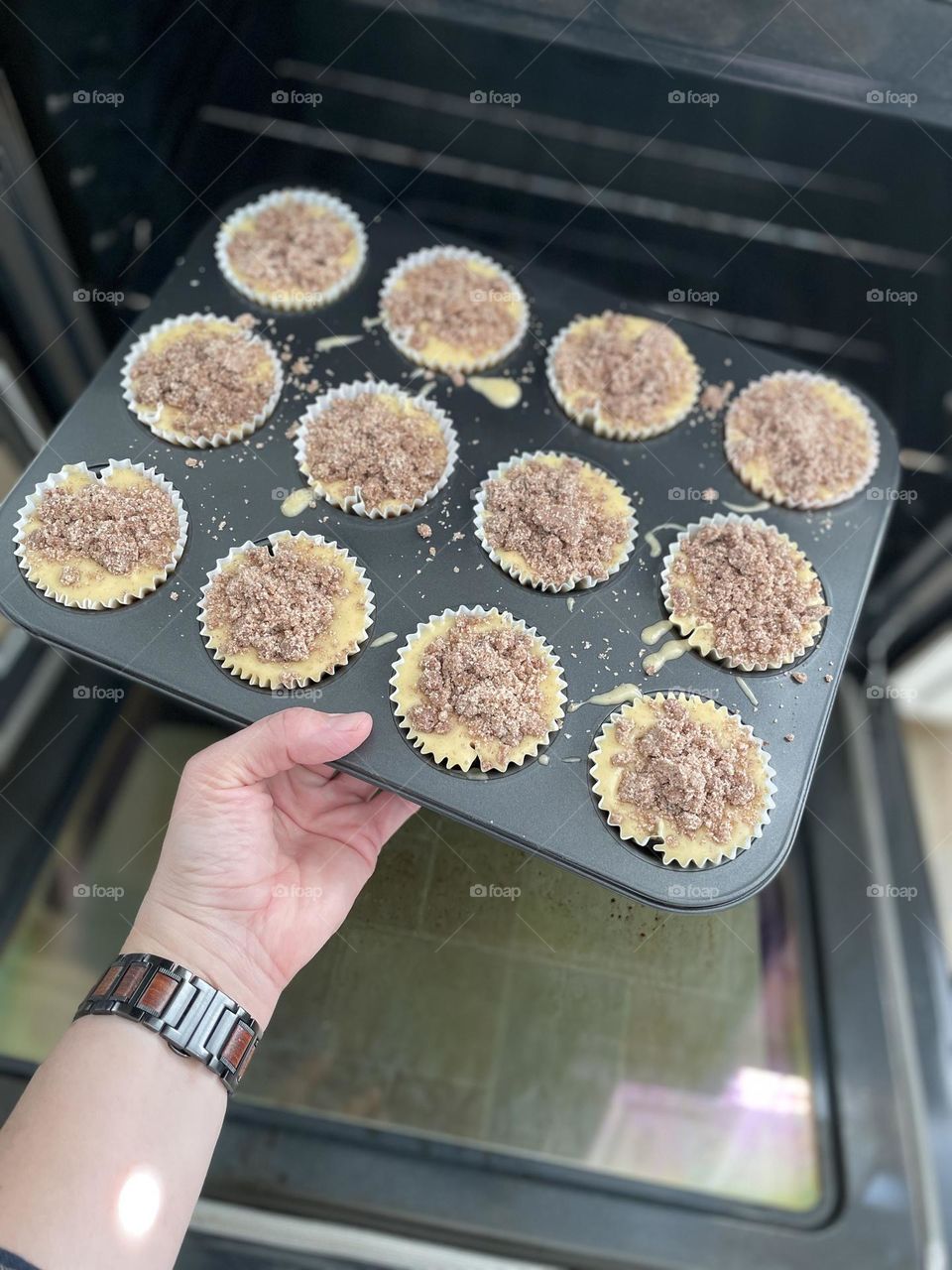 Mother making muffins for toddler, putting tray of muffins in the oven, baking in the kitchen, circles in the kitchen, muffins for the family, making memories in the kitchen, circles in everyday life 