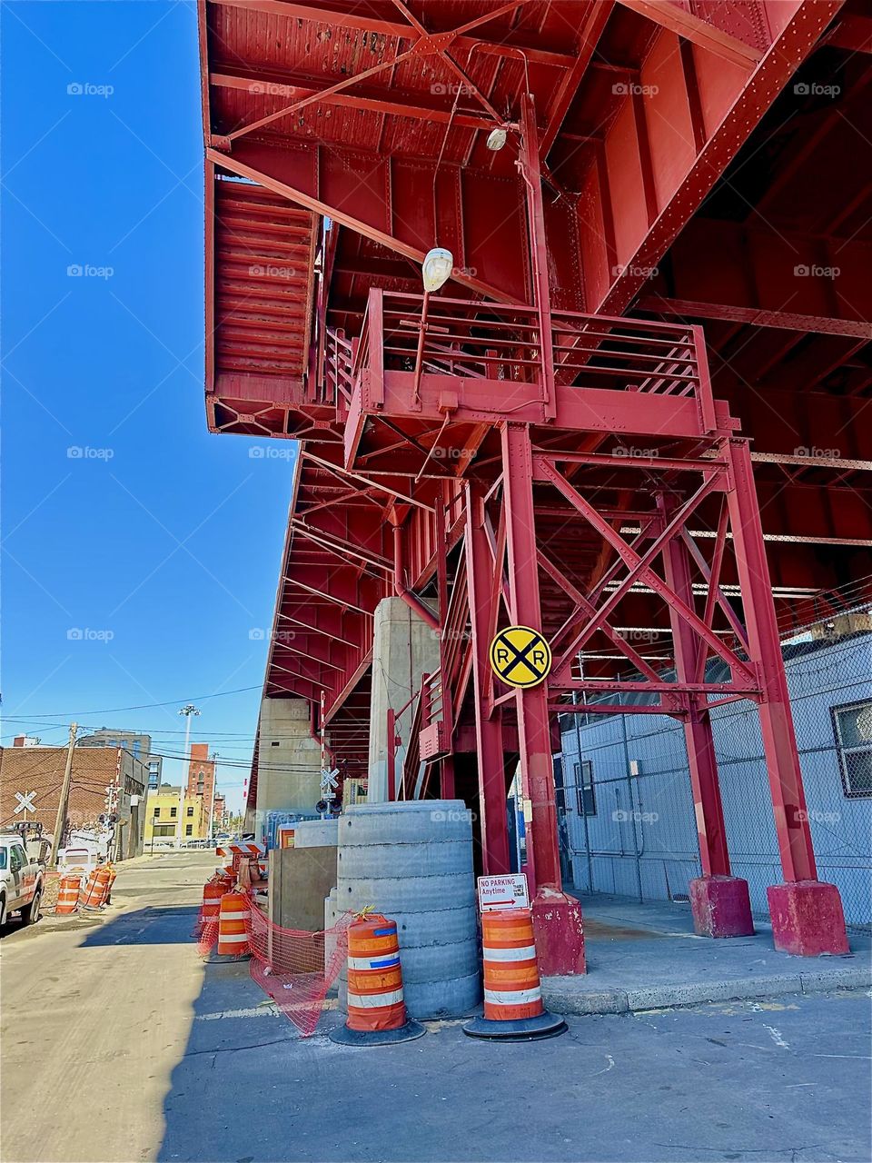 This is the red metal staircase and supportive structures of the “Pulaski Bridge” at “Newtown Creek” in LIC, Queens on a sunny afternoon in March 2024. Hypnotic Productions