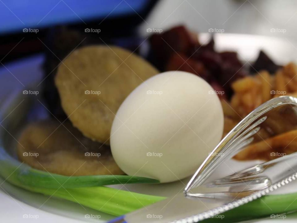 Passover meal from a different angle. Showing the hard boiled egg accented by an onion leek