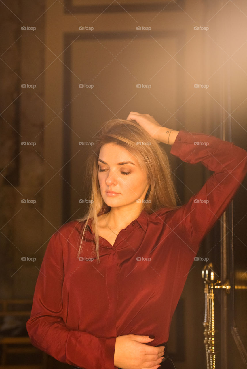 Beautiful blond girl posing on camera