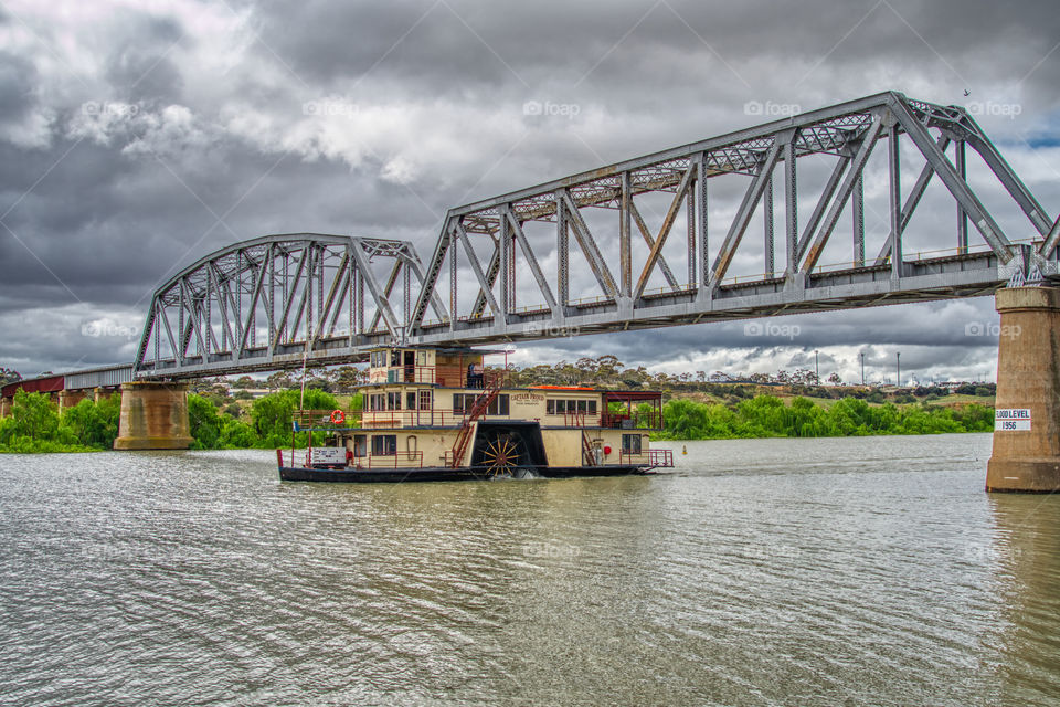 The Captain Proud paddleboat with the Murray Bridge Rail bridge behind