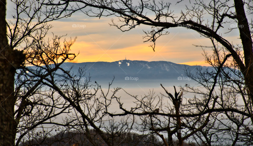 Winter sunset with view at Medvednica mountain covered with snow