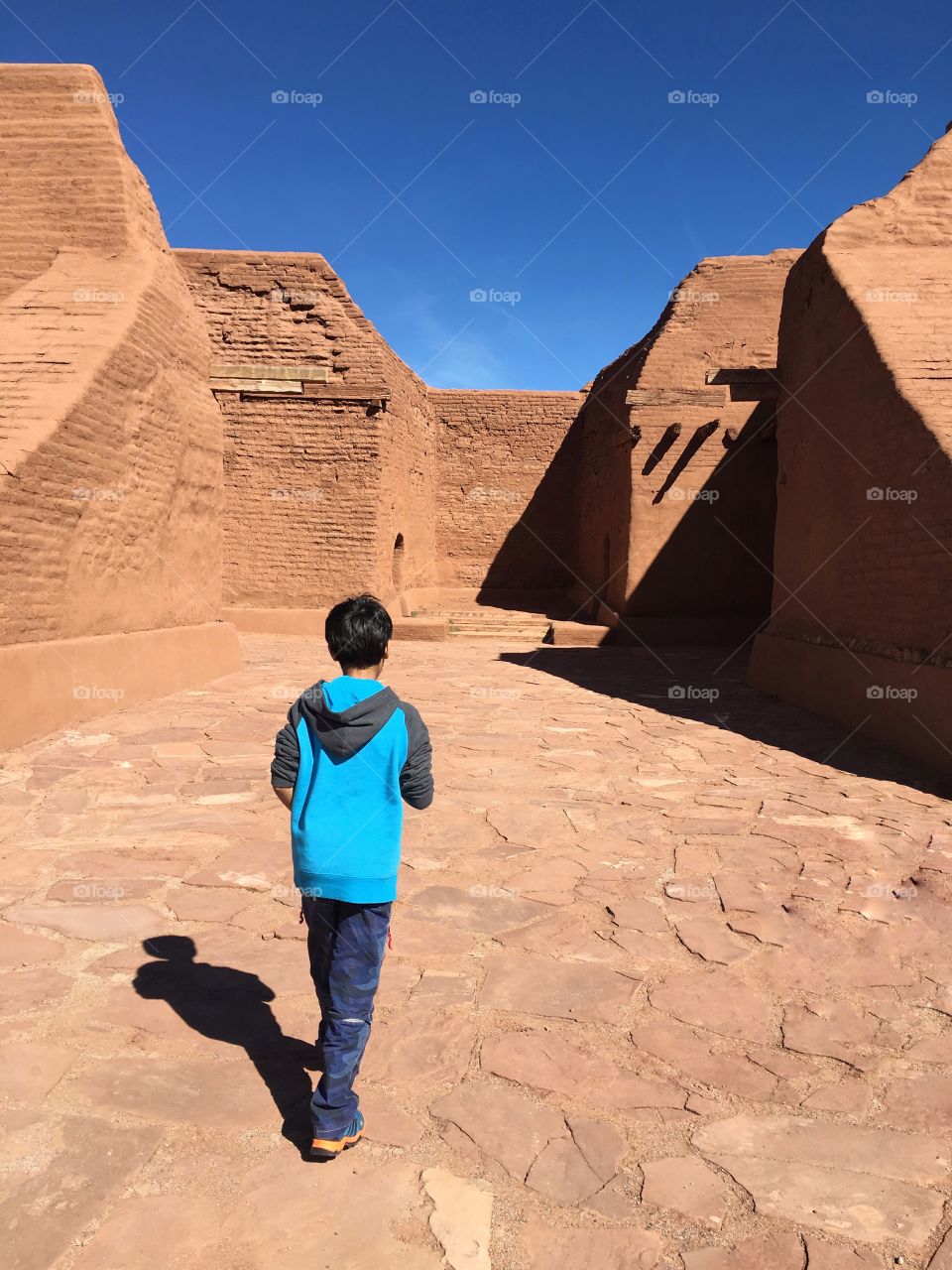 Boy exploring Pecos pueblo