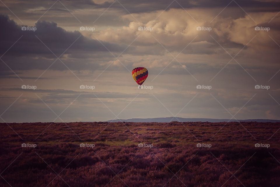 hot air balloon over moorland