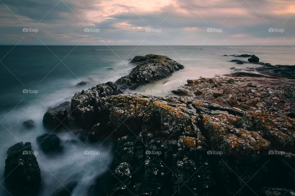 Long exposure, sunset at Seaweed beach in County Galway, Ireland