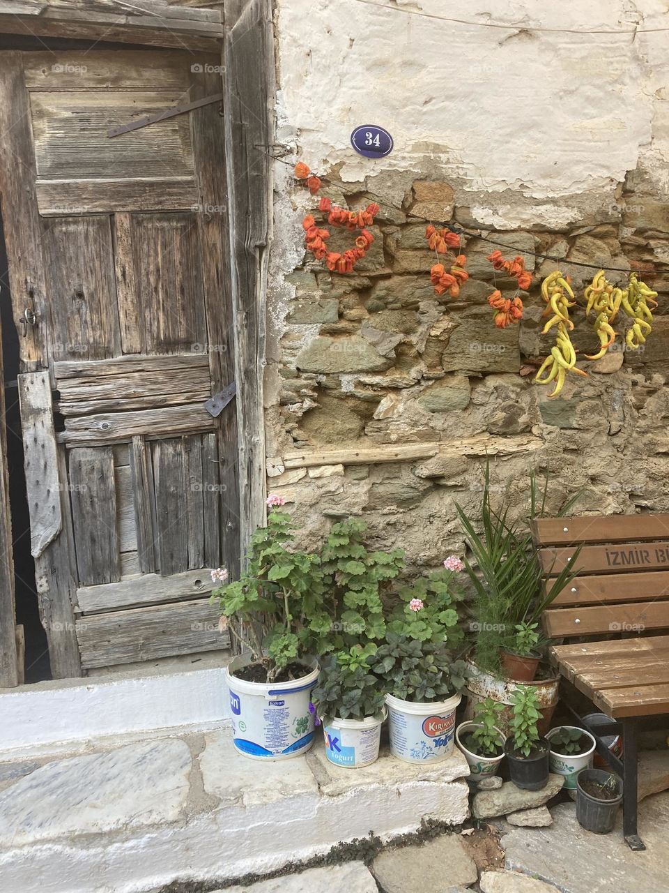 Greek village in Turkey. Blue sky and tall palm trees. Sunsets and sunny days. Summertime in Kusadasi. Vacation travel in Turkey . Summer view. Sunny day during vacation. Hidden gems and secret places.