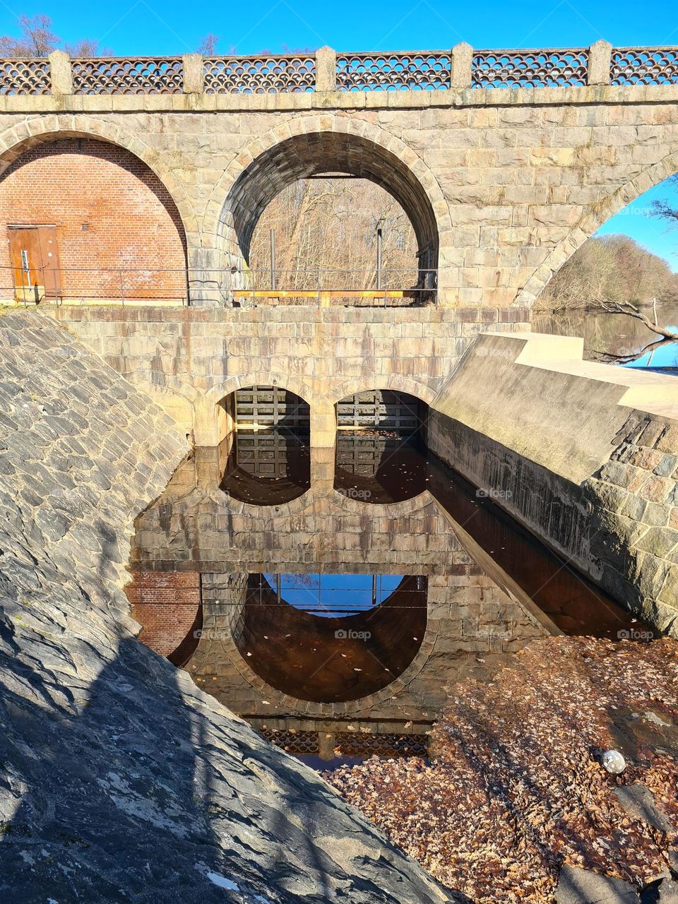 Reflections of an old bridge