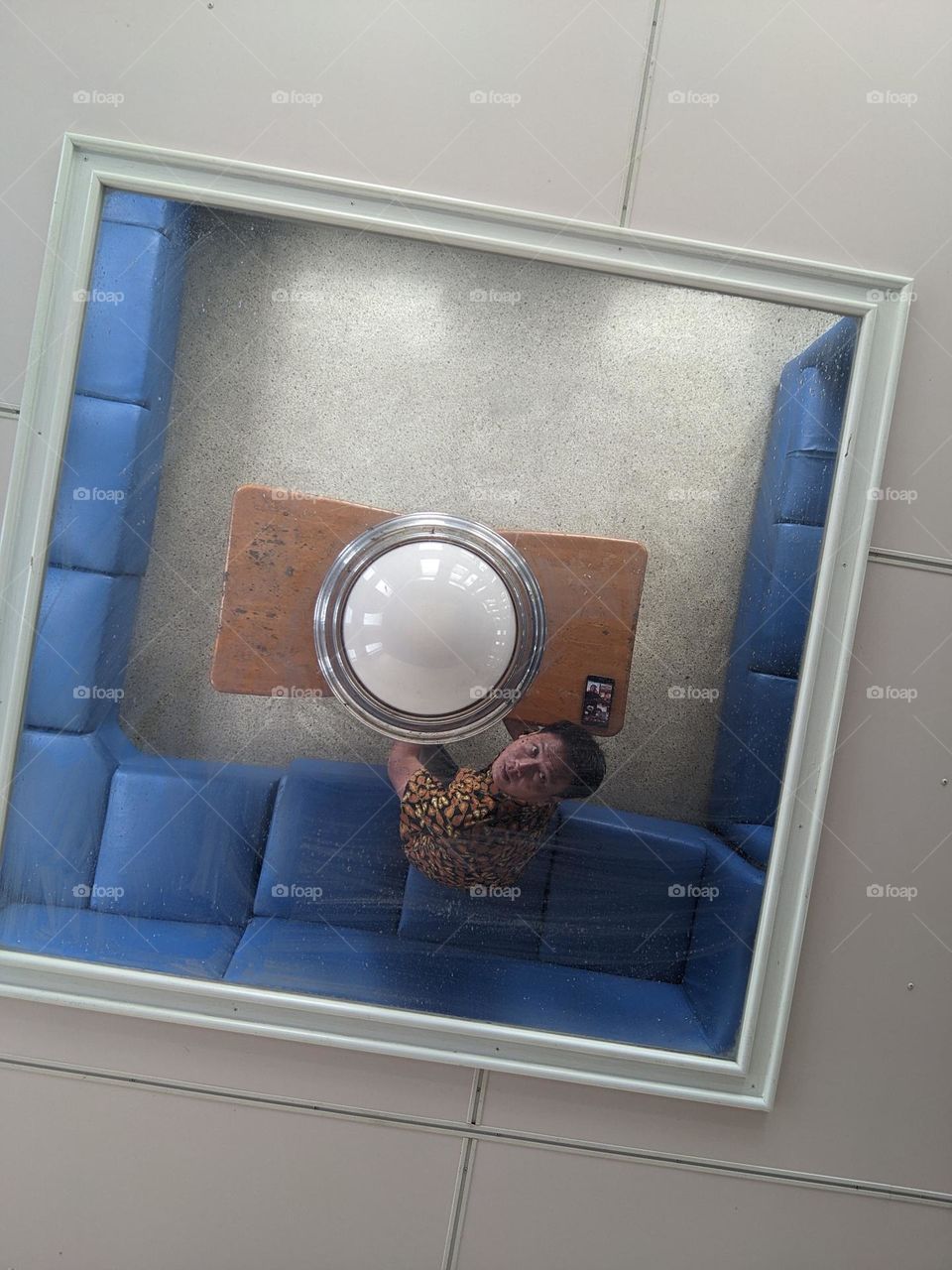 the mirror lamp above sofa at Ferry boat Bengkalis to sei pakning