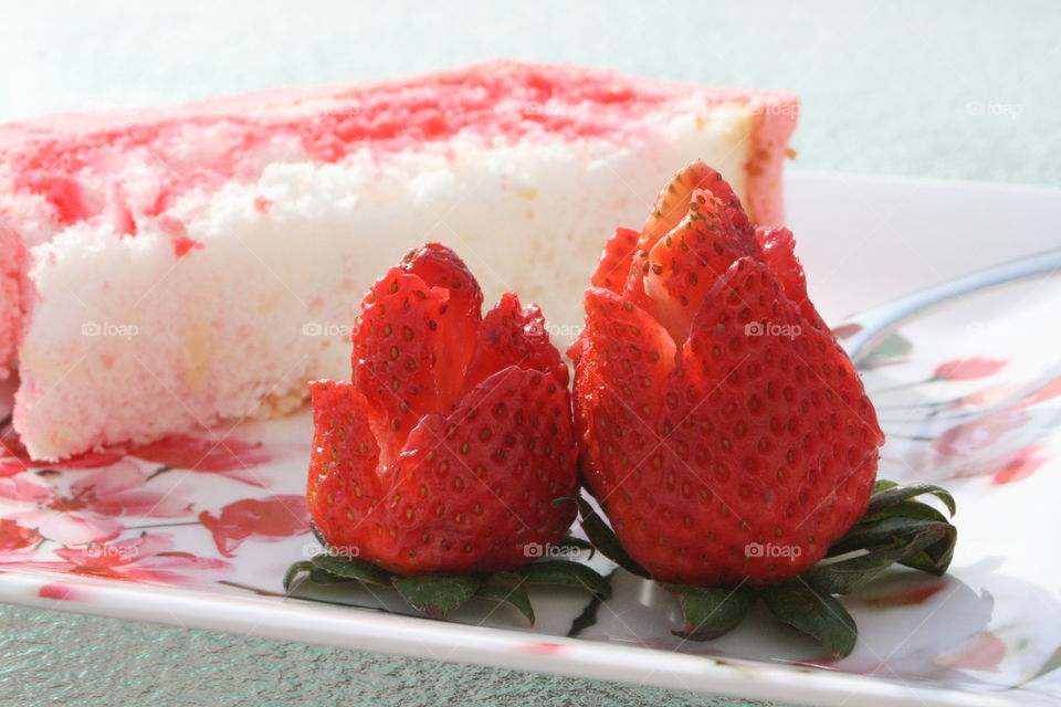 Angel Food Cake with Strawberry Jello and Cool Whip with rose cut strawberries 