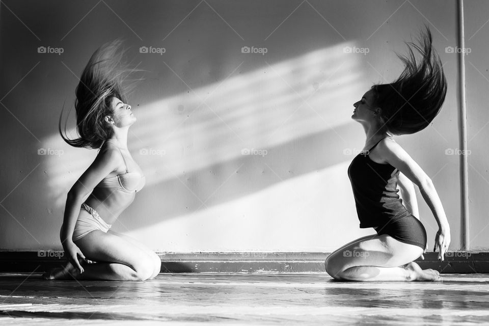 Close-up of two woman dancing