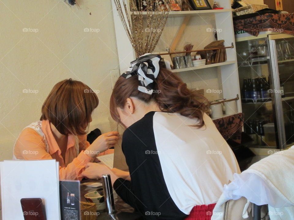 Two Fashionable Girls. Friends Eating in Restaurant.  Nakameguro, Tokyo, Japan.