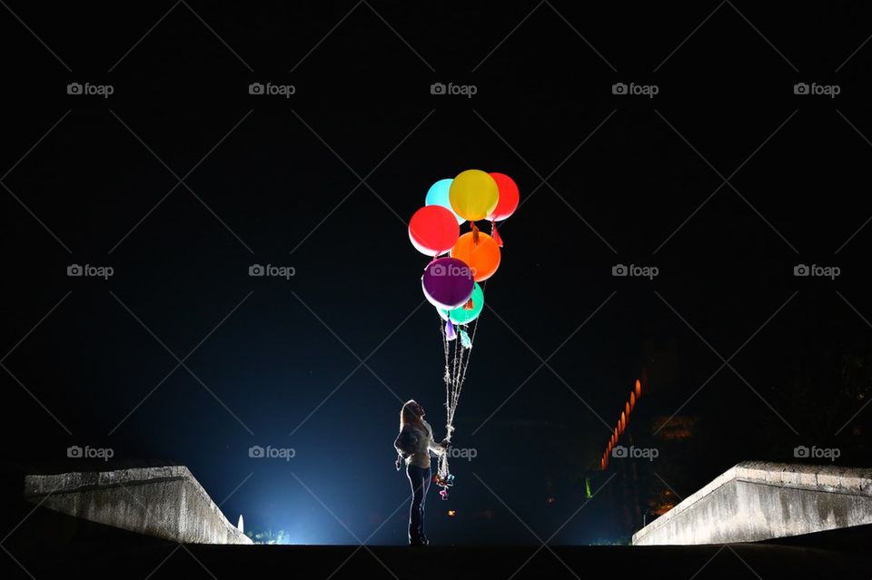 Woman and large multicolor ballons