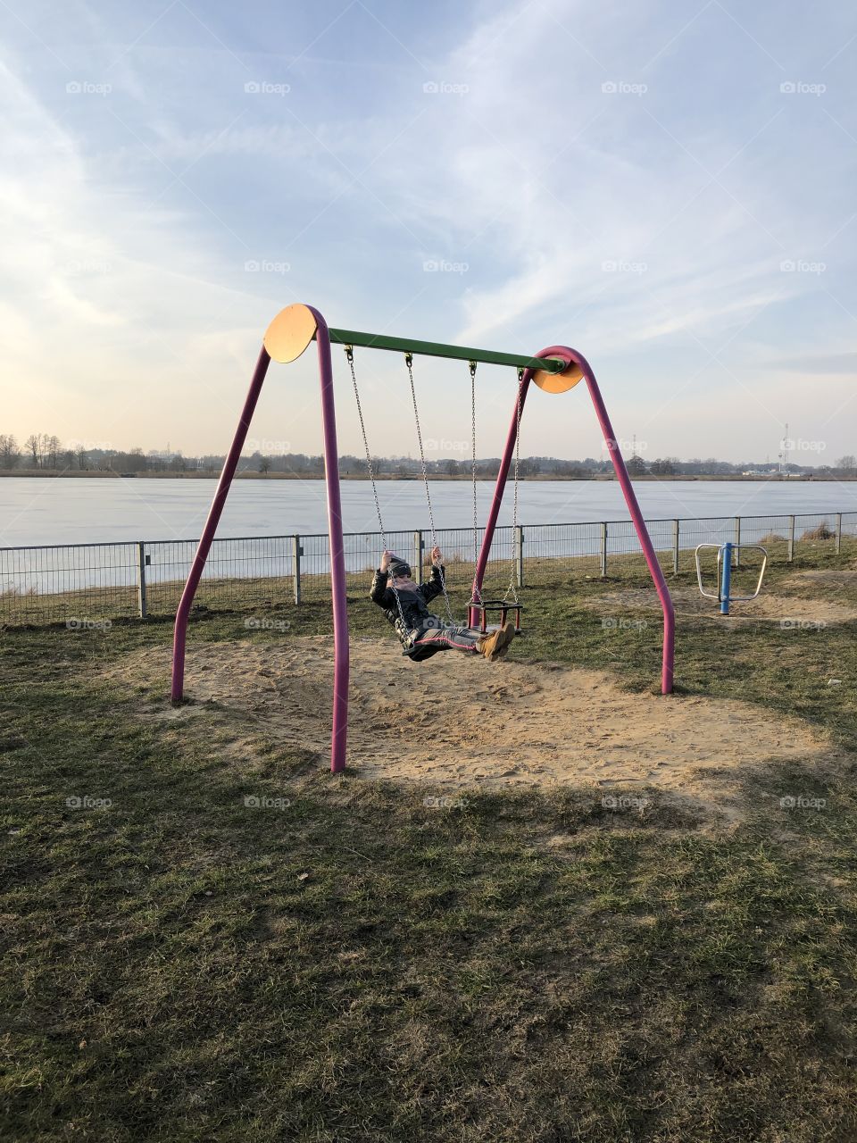 Little girl swinging 