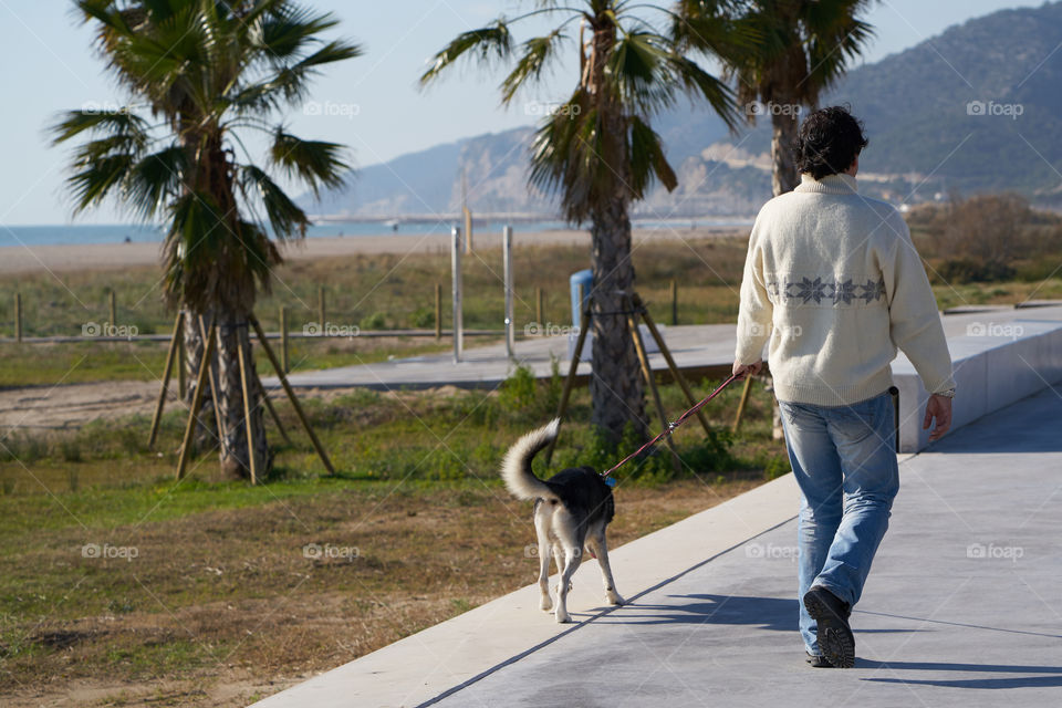 Walking by the seaside walkway 