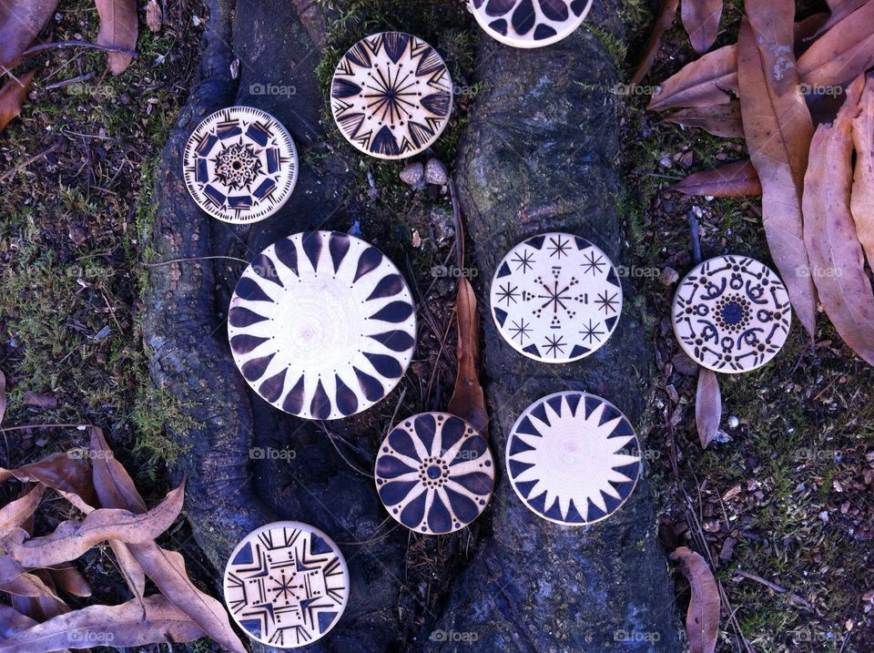 Mandalas. Wood-burned mandalas outside in the fall.