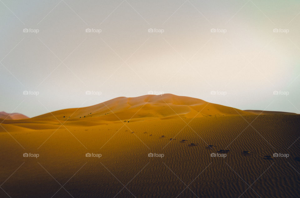 Sand dune against sky