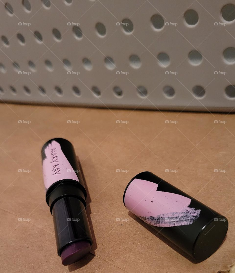 berry Mary Kay intuitive PH lip balm beauty product on neutral background