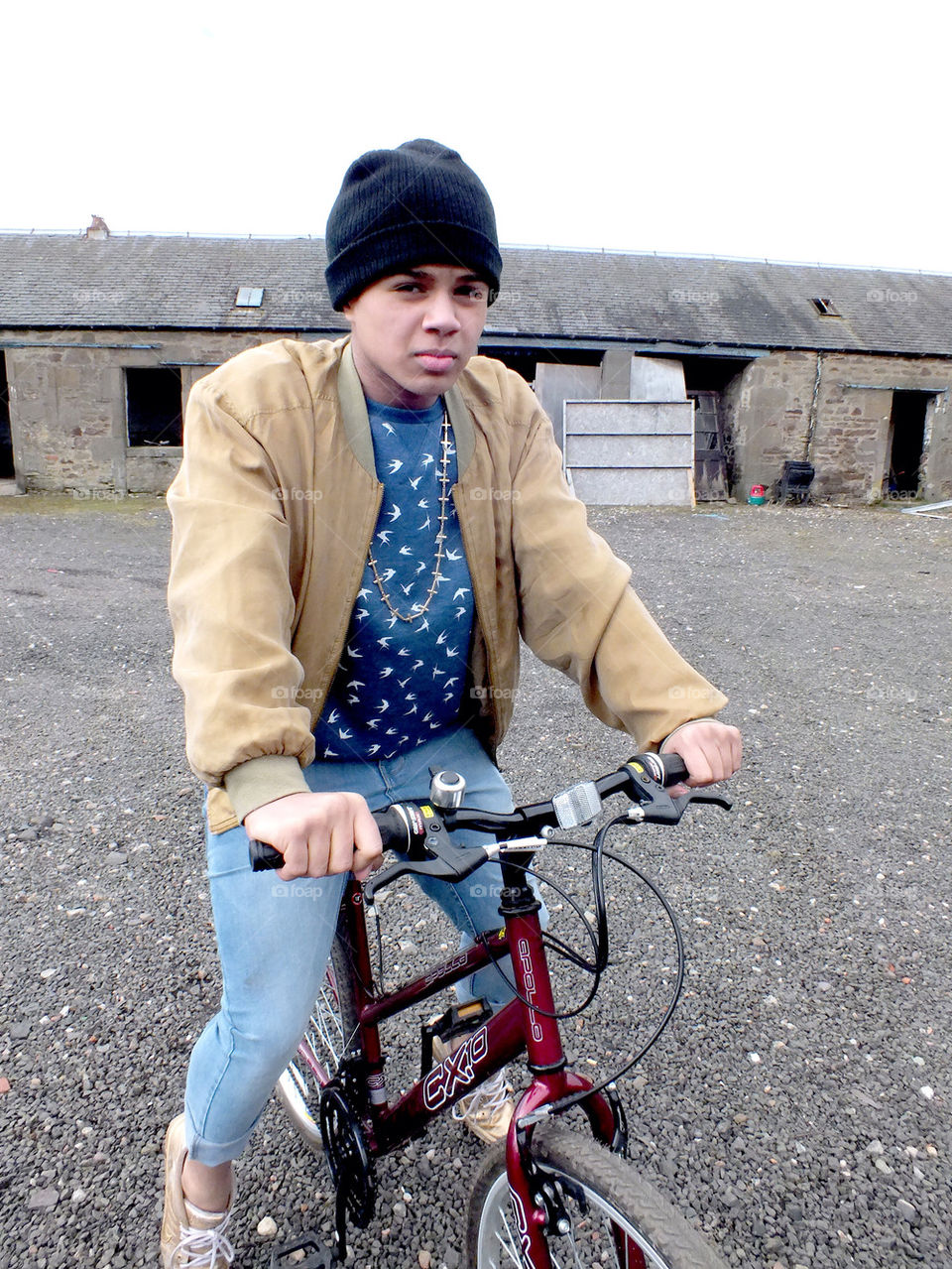 Teenager on small bike