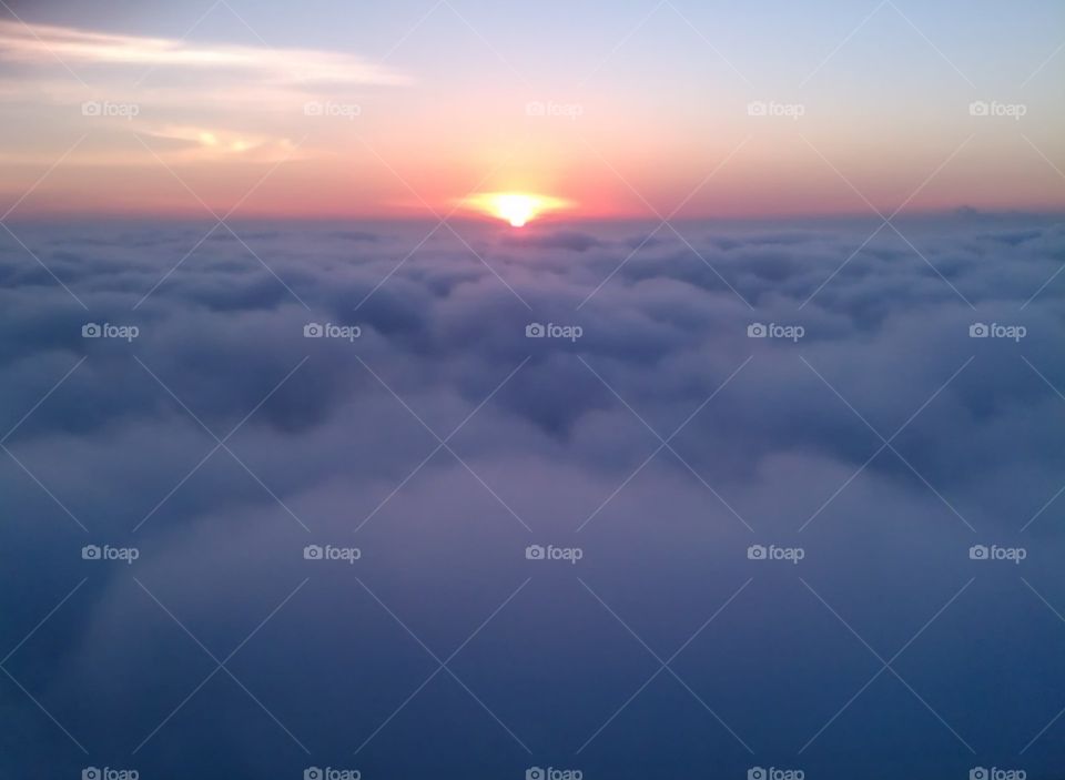 Morning Glory. a beautiful shot of the sunrise from above the clouds