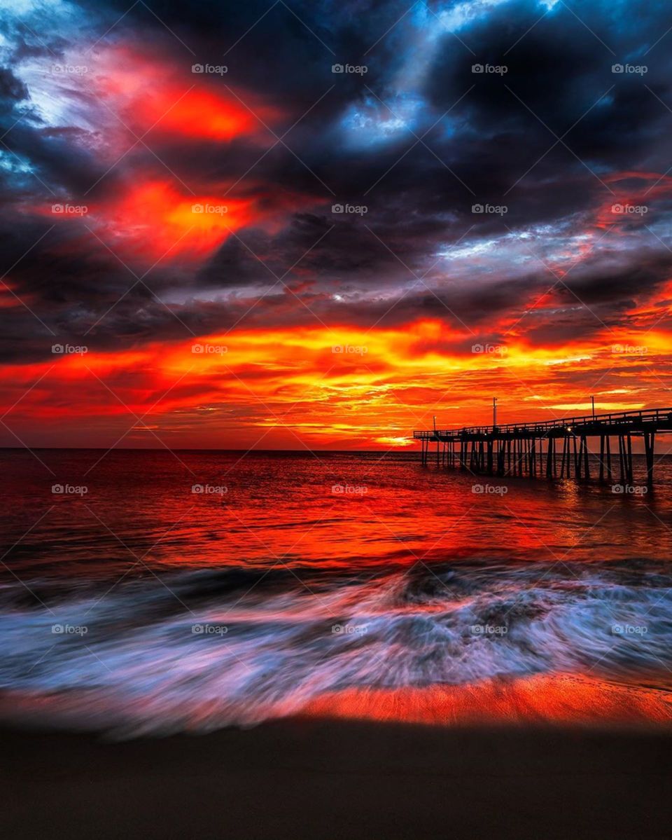 red sky reflection on the ocean