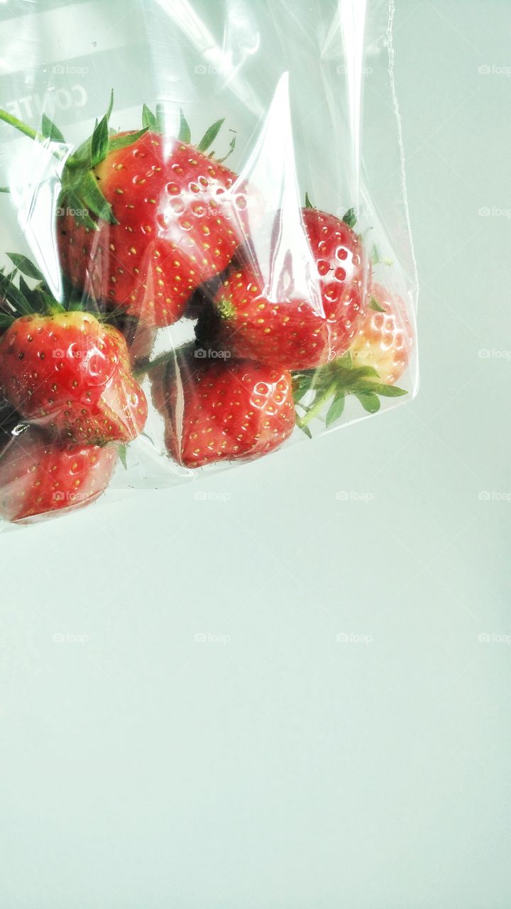 Strawberries in clear plastic bag