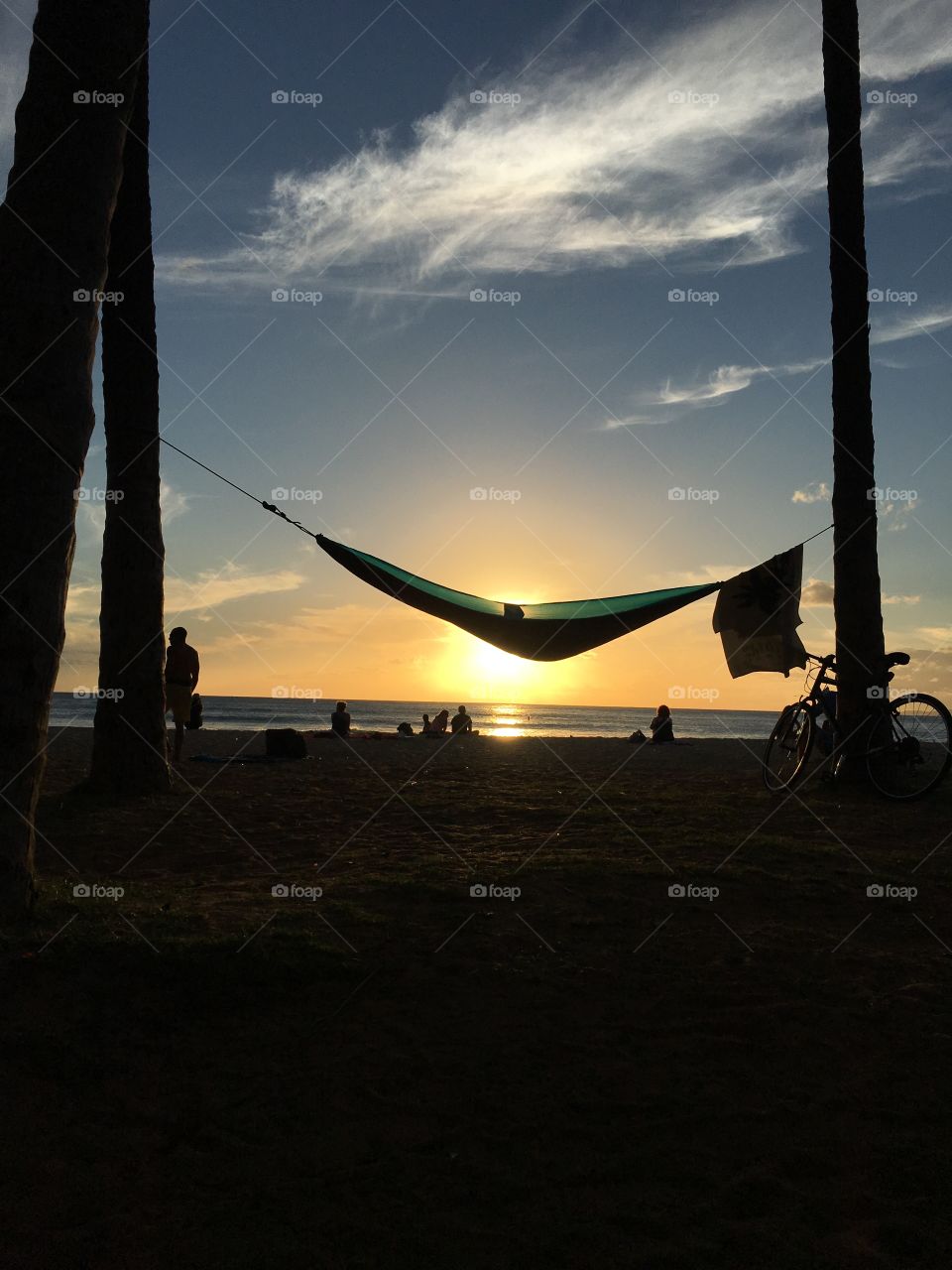 A typical evening in Honolulu is often spent down by the beach relaxing and watching the sunset