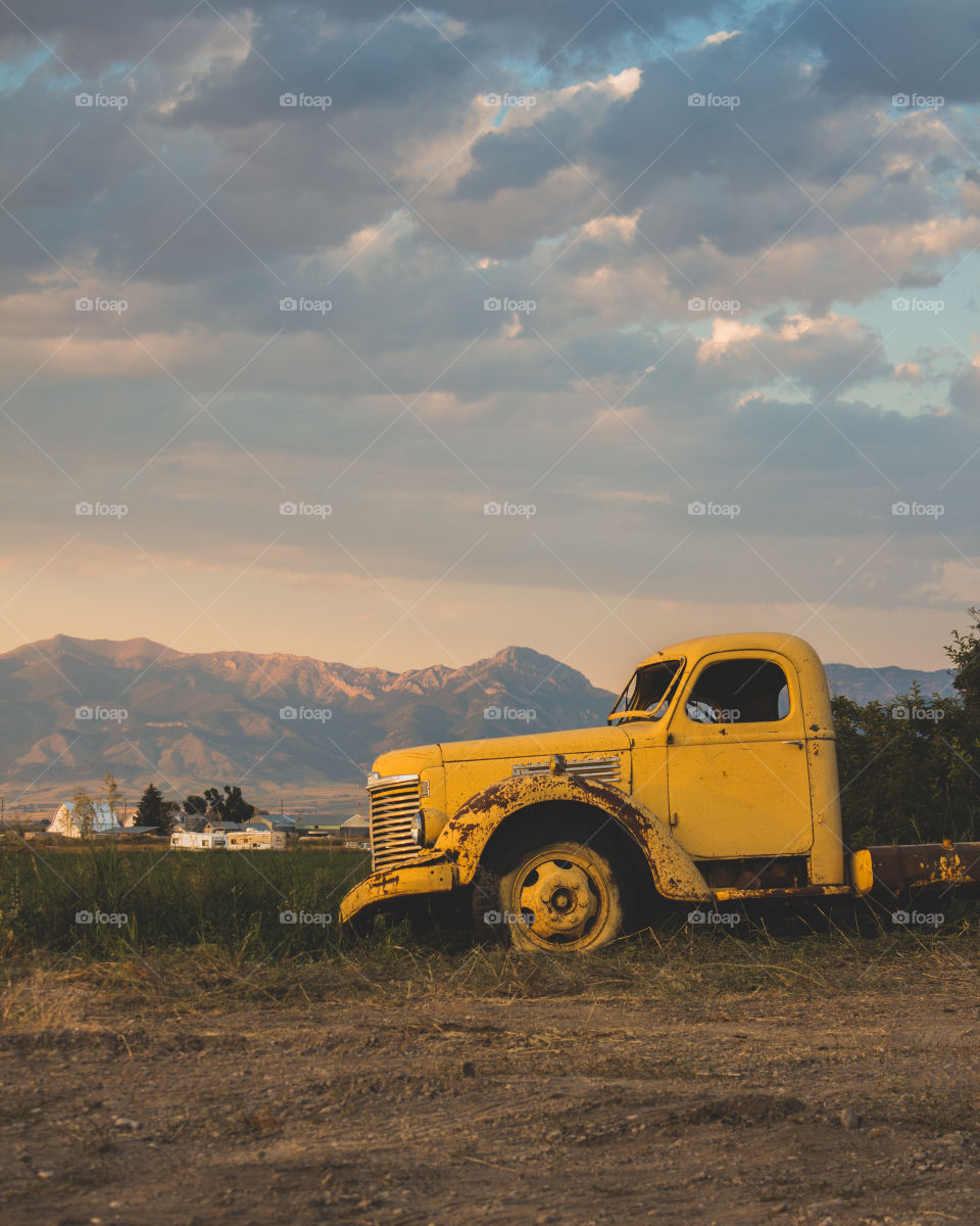 Old yellow truck at golden hour