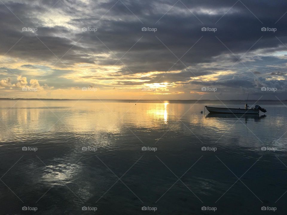 Sunset on lagoon with grey and yellow shades