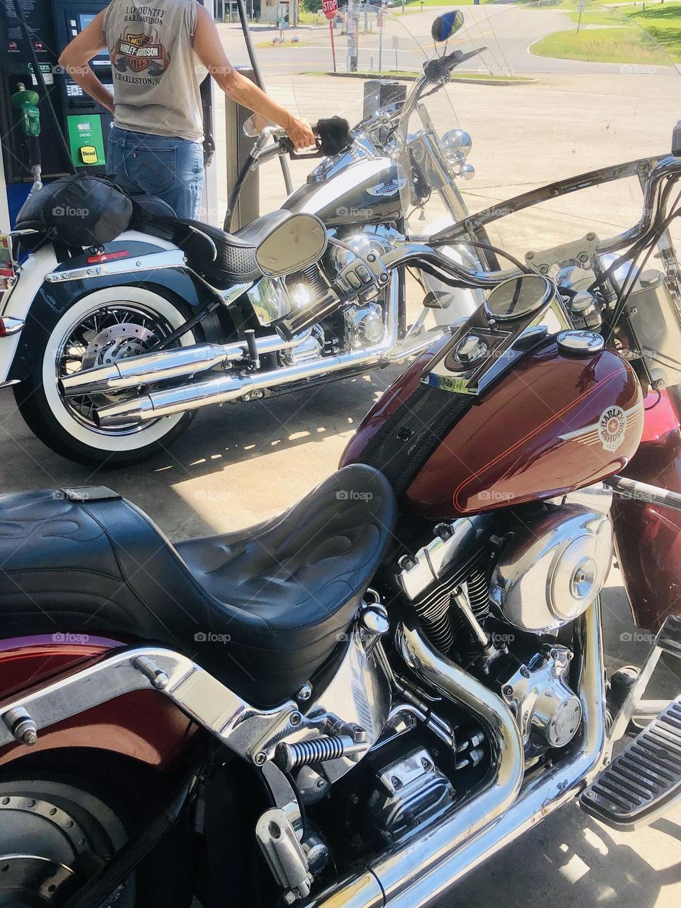 Commuting by motorcycle filling up at a gas station