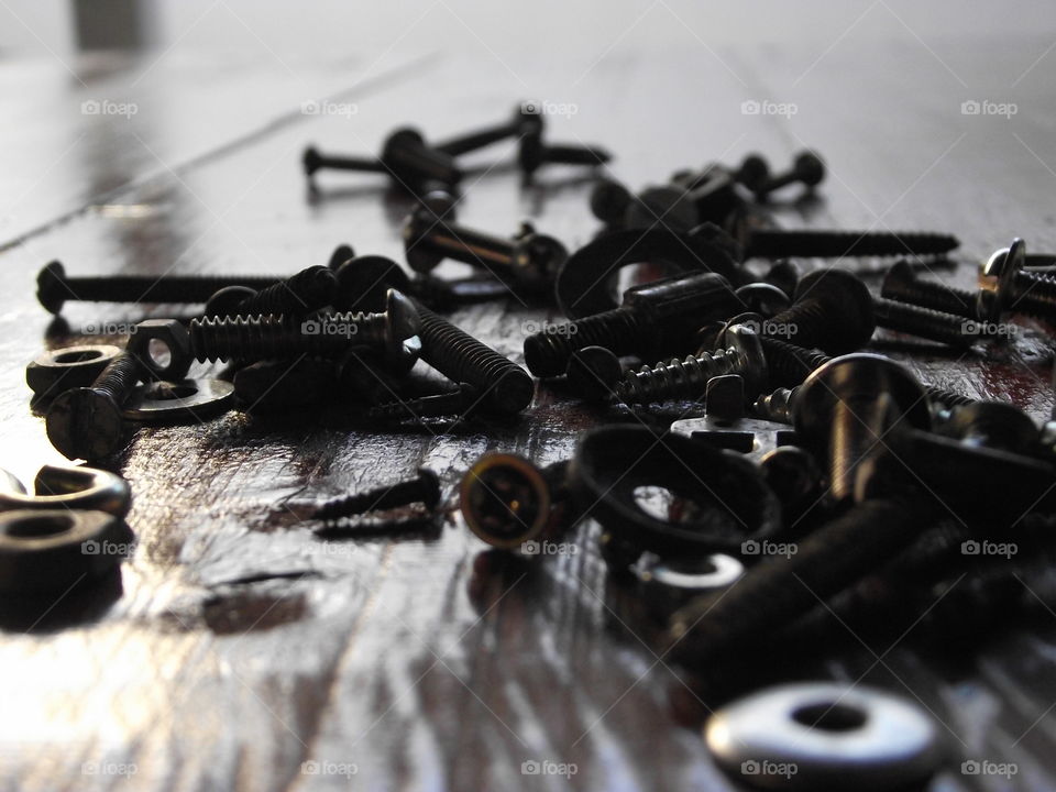 Close-up of nuts and bolts on table