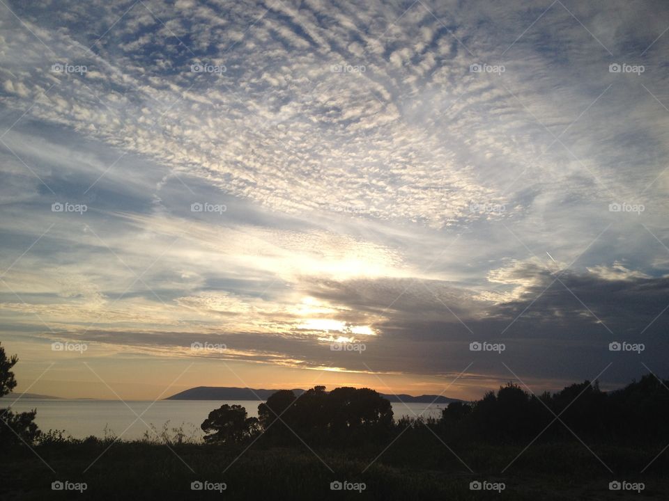 Nice weather. Beautiful view on sea, island and clouds