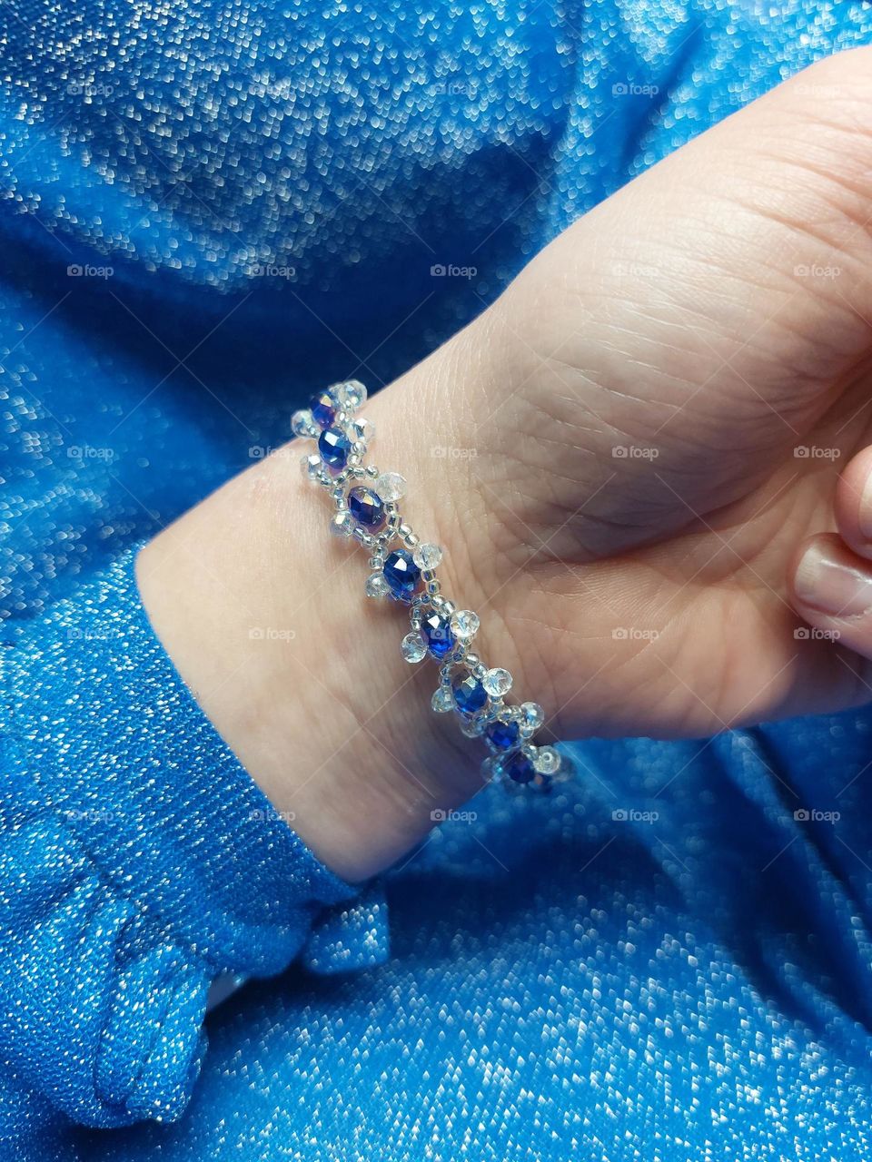 handmade braclet with blue sparkly stones.