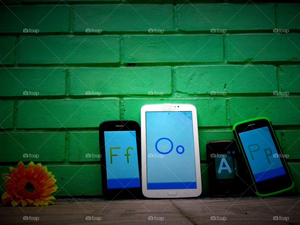 different mobile gadget with letters spelling the word foap