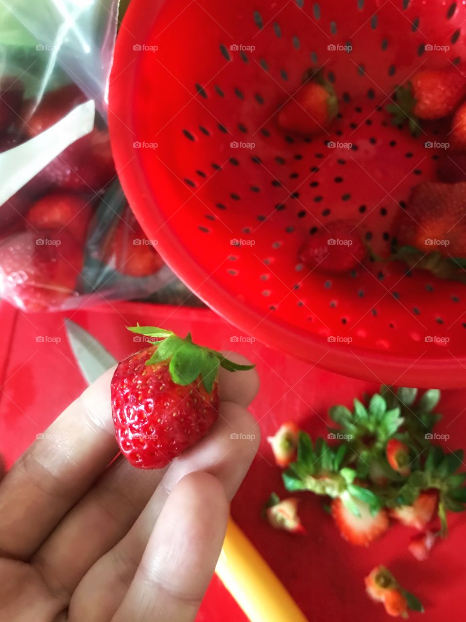 Cutting beautiful, red strawberries