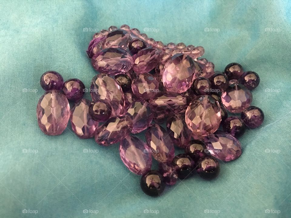 Amethyst beads on fabric 