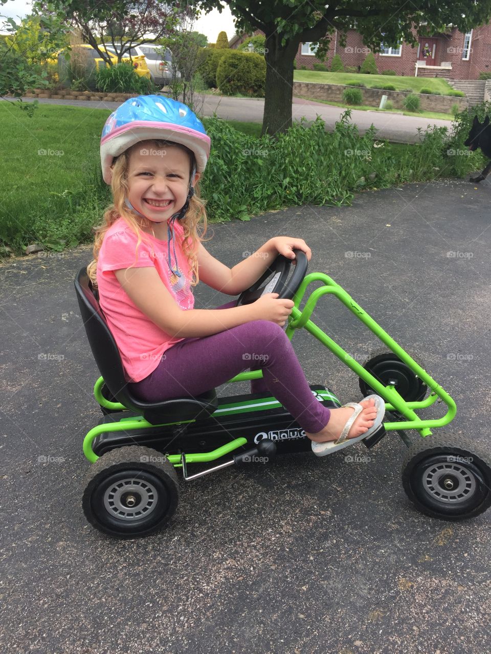 My five year old daughter happily biking along. 