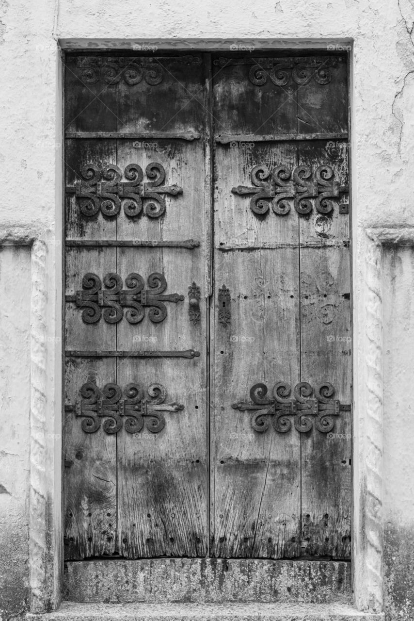 Old wooden door with rusty metal decorations, Ronda, Malaga,Spain