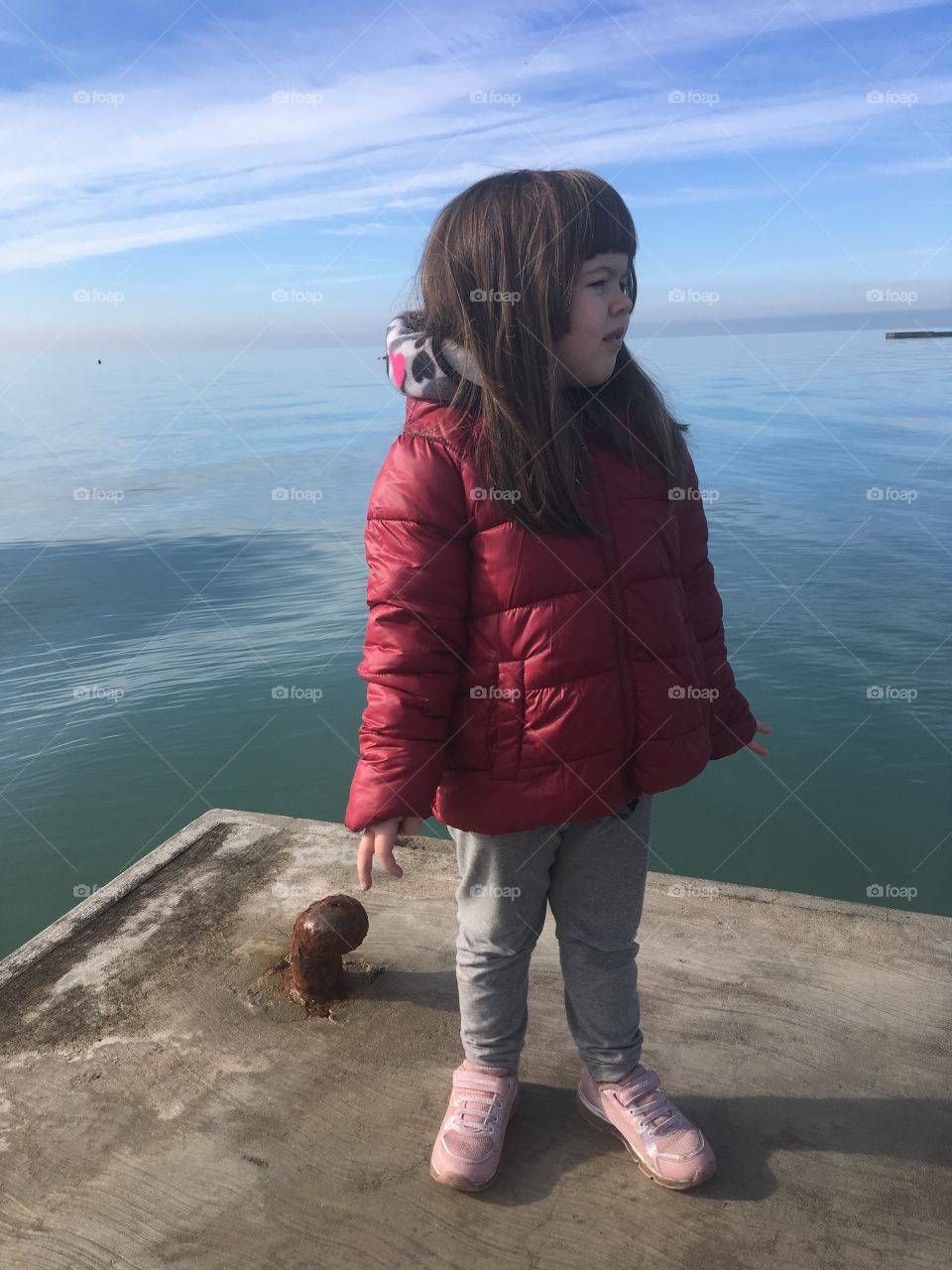Girl sea winter beautie 5 year old Grado Italy seashore seaside pier deck 