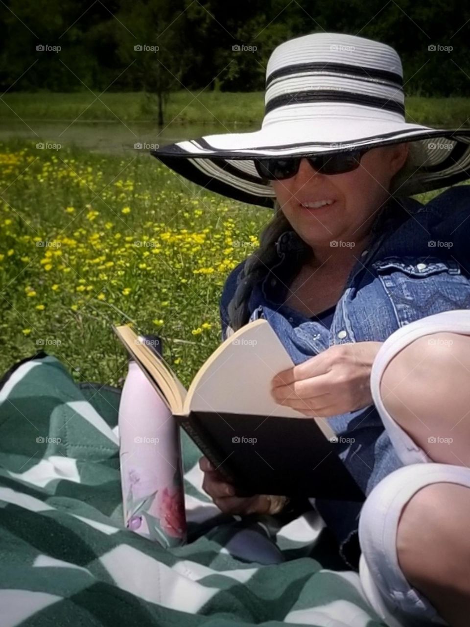 Woman Reading a Book on a Picnic