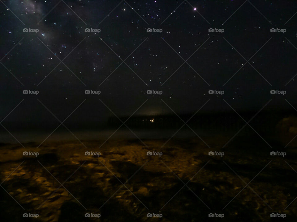 milky way and ocean pier