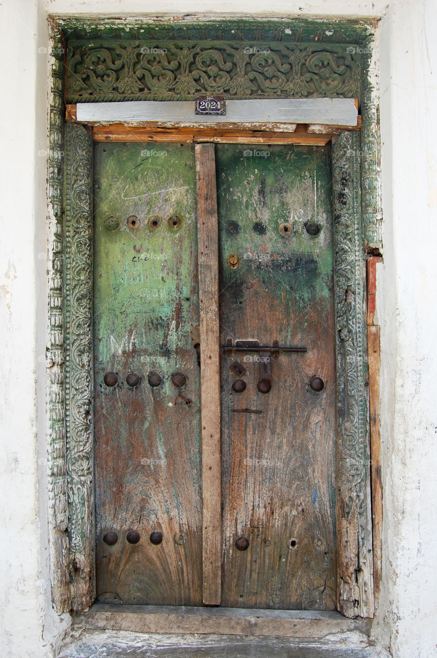 Old worn door in Stonetown on Zanzibar.