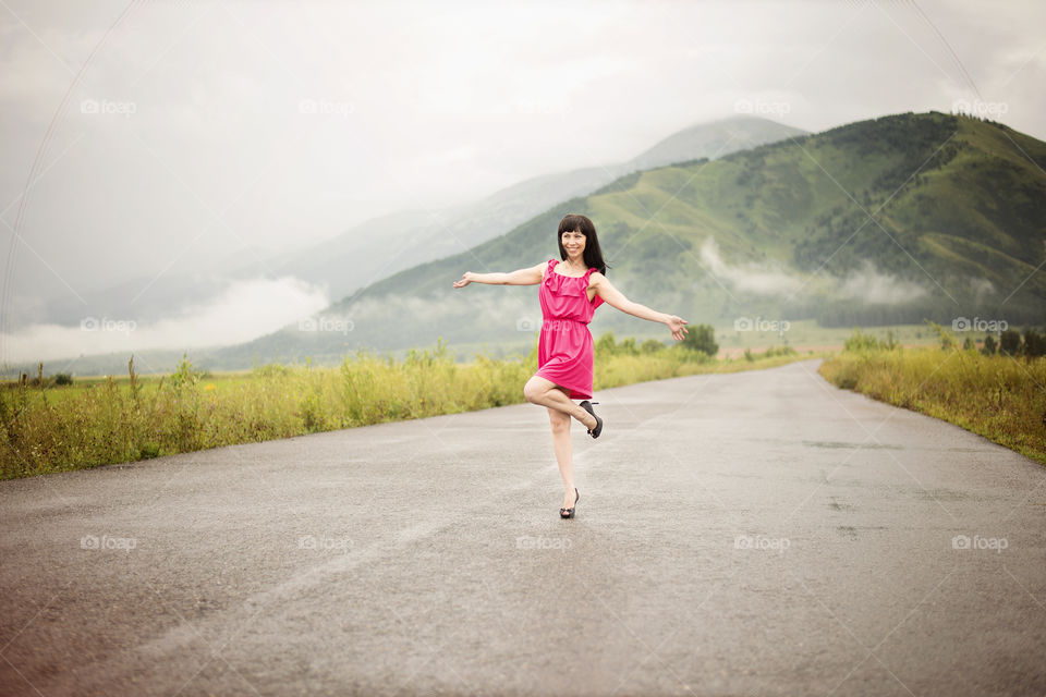 Young woman posing on street