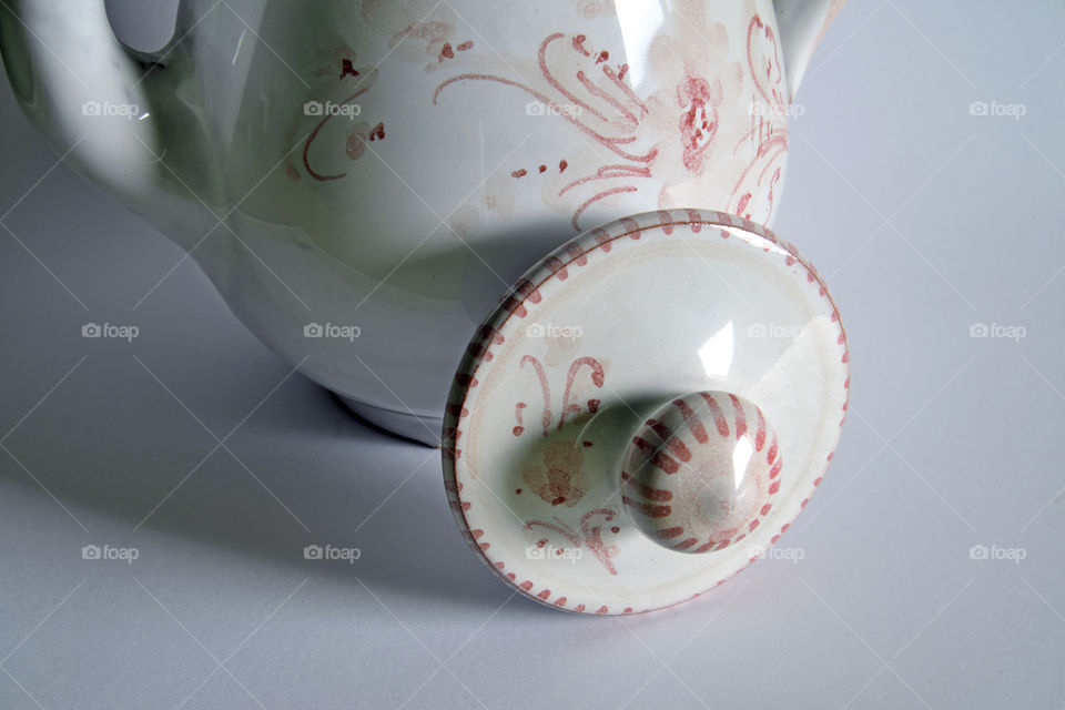 Close-up of teapot on white background