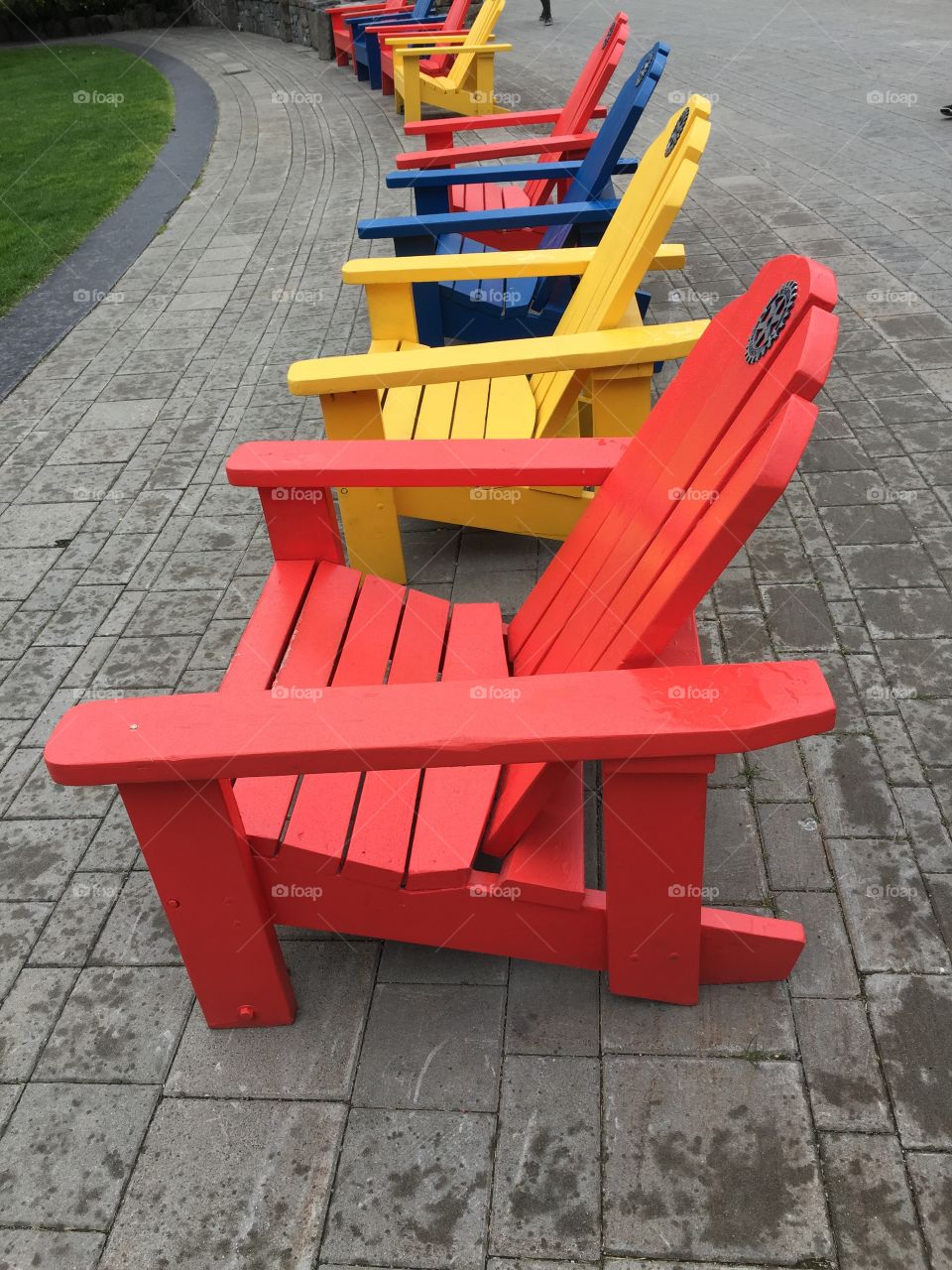 Colourful red, yellow and blue Adirondack chairs in Whistler, British Columbia