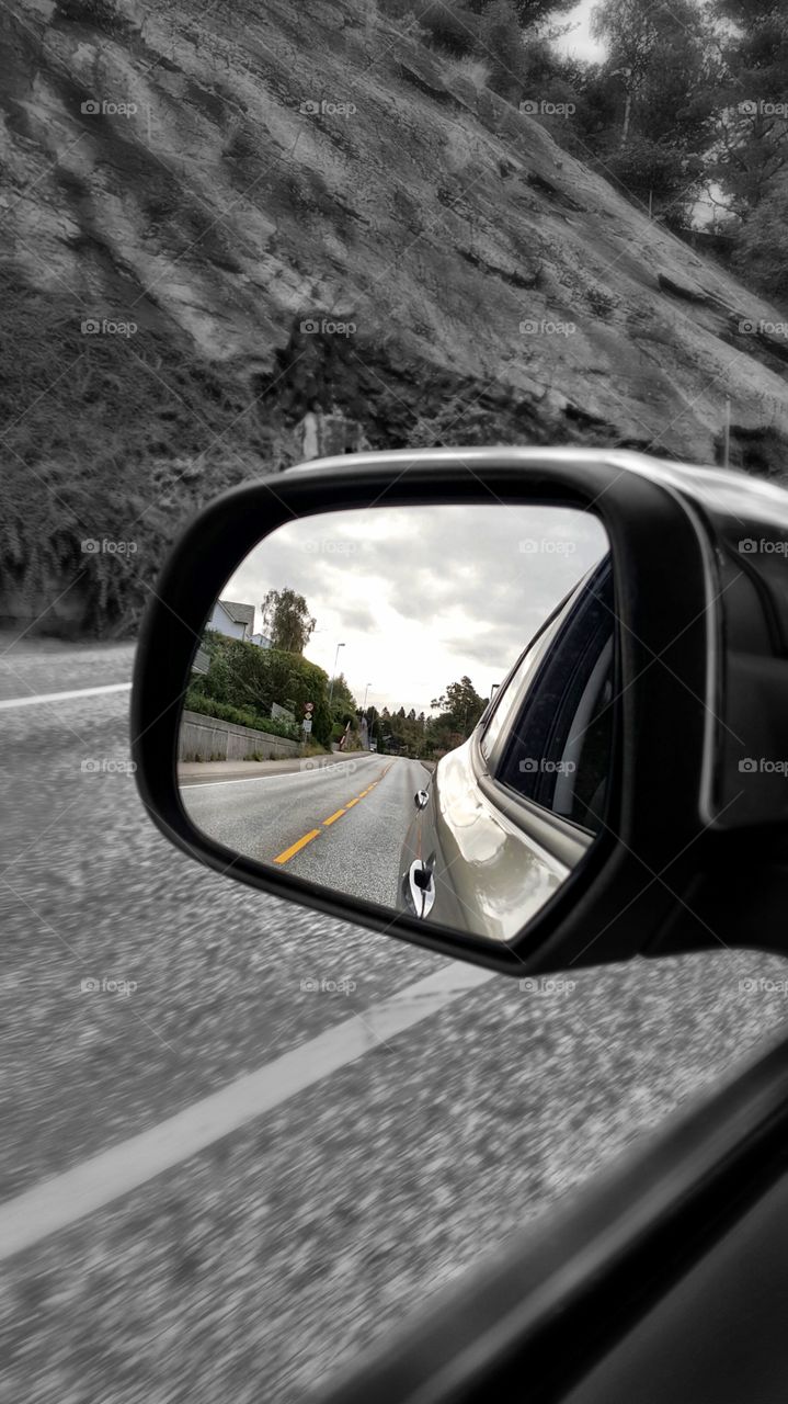 Close-up of side mirror of car