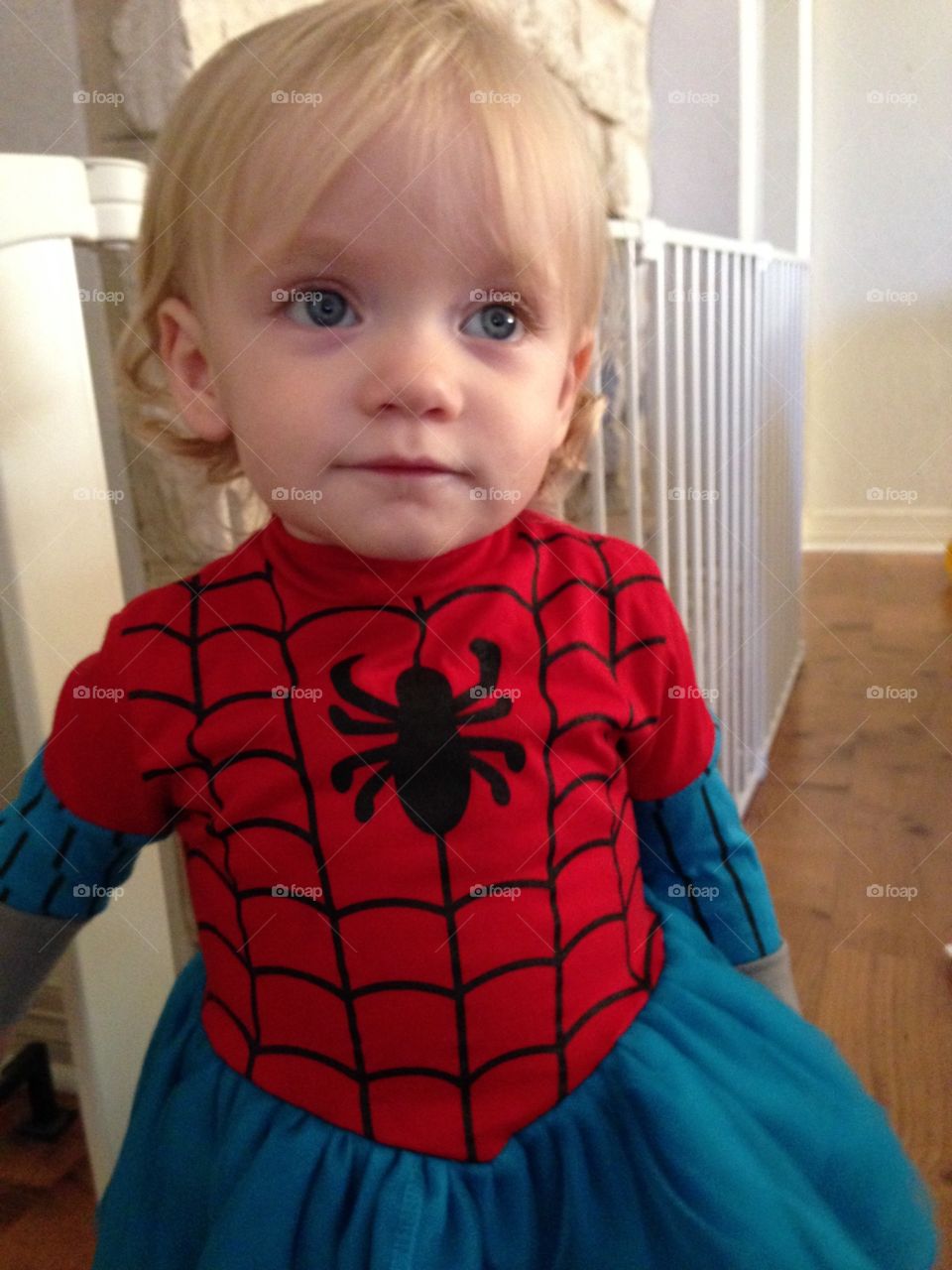 Toddler in a spider girl costume 