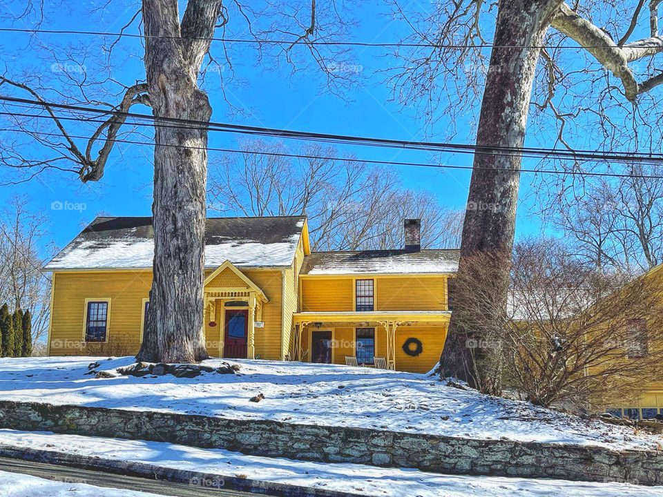 Yellow house against a blue sky